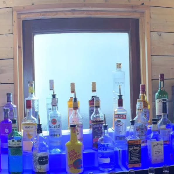 LED-lit back bar with premium spirits