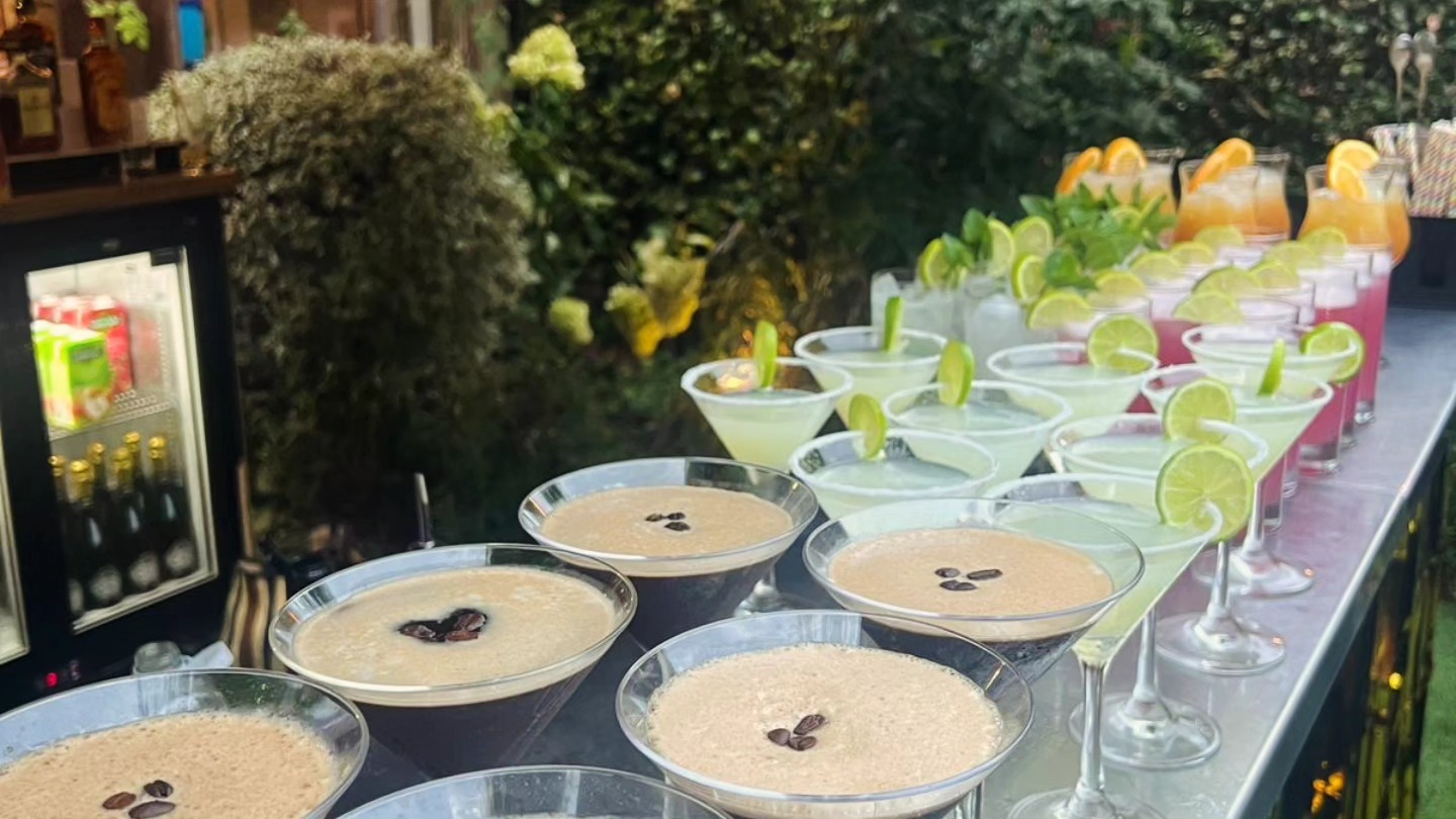 Lineup of espresso martini cocktails ready to serve at a London event by The Sesh Bars