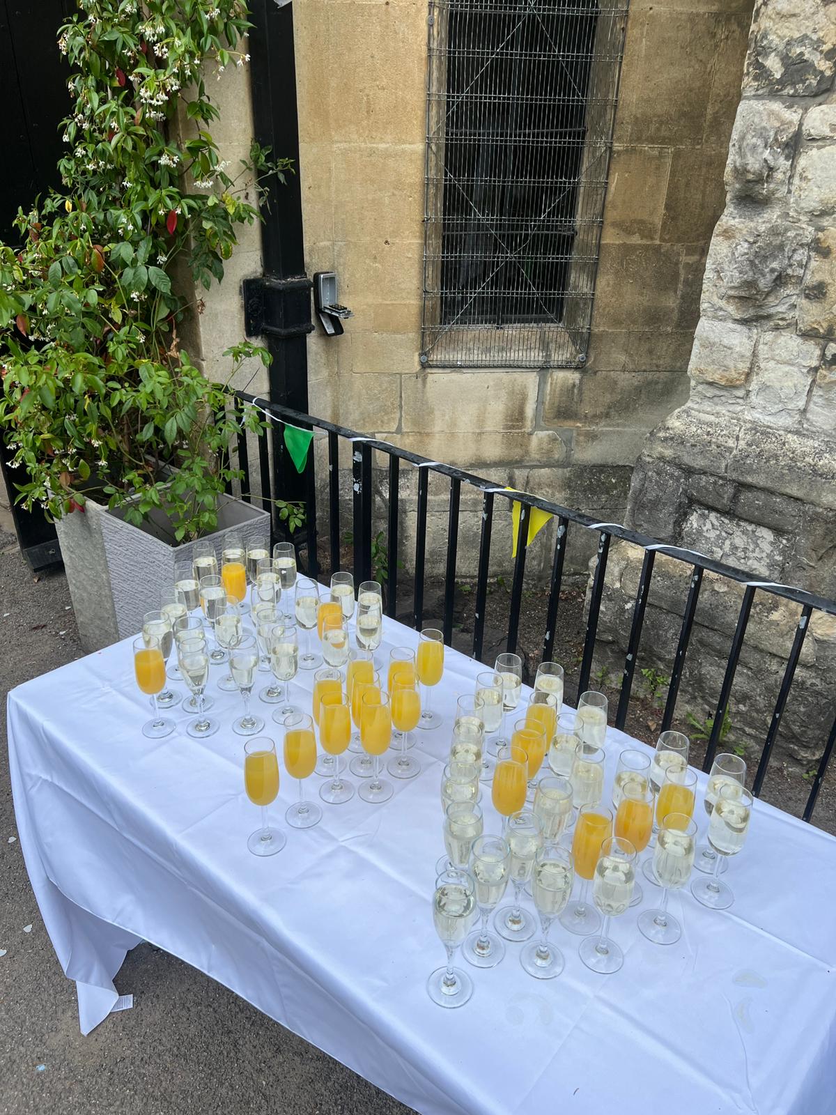 Champagne and mimosa reception drinks at a church wedding venue