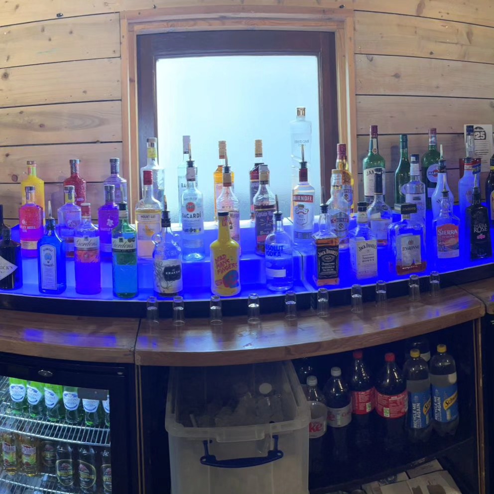 Fully stocked dry hire mobile bar with LED backlighting, beer fridges, and spirit display