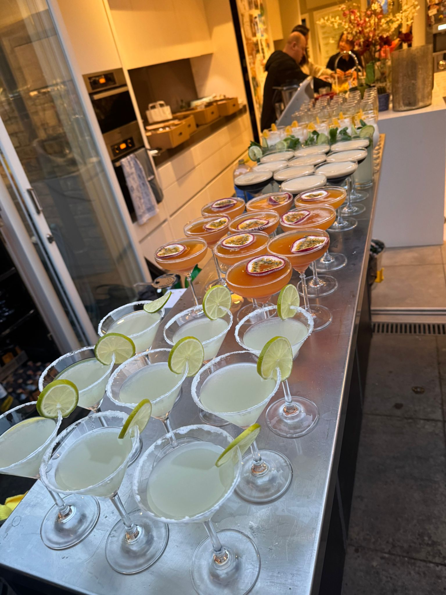 Pornstar martinis and margaritas lined up on a mobile bar ready to serve