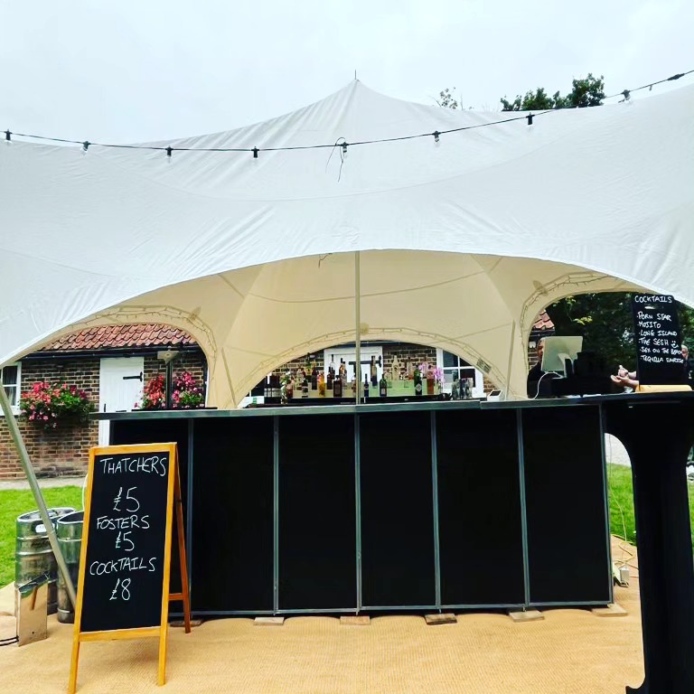 Mobile bar tent with chalkboard menu at a Berkshire country estate event