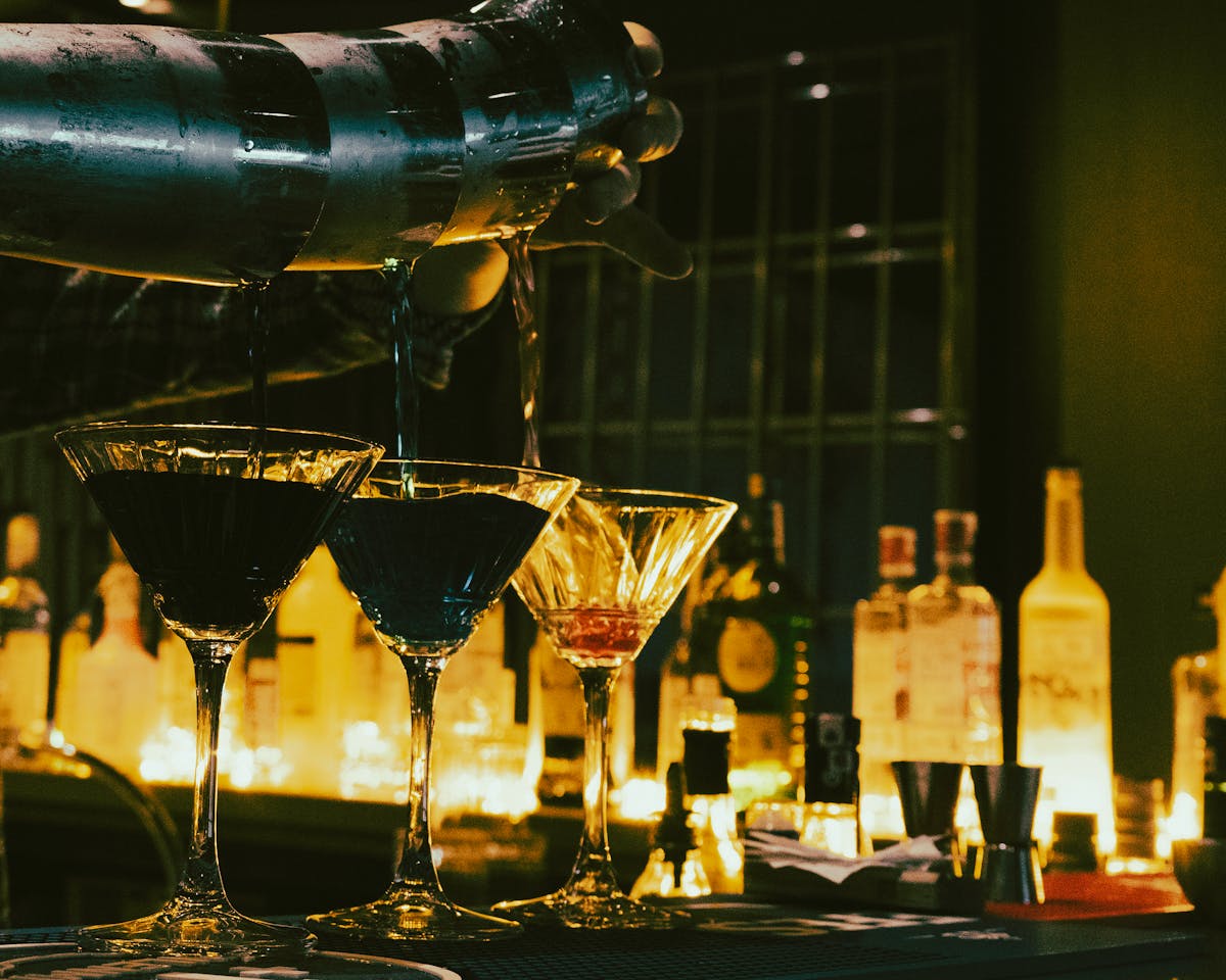Bartender pouring cocktails at a mobile bar hire event in London
